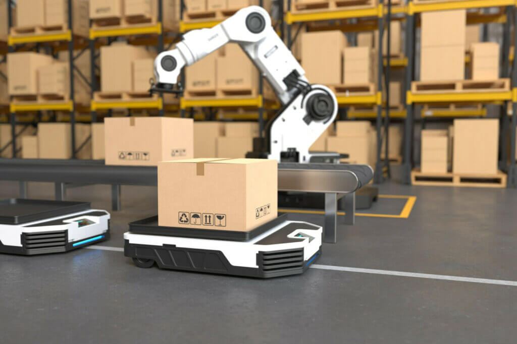 Robot arm picks up box in warehouse